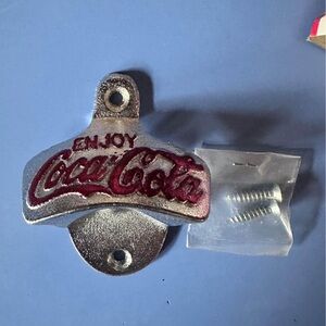 Coca Cola bottle opener for wall.
